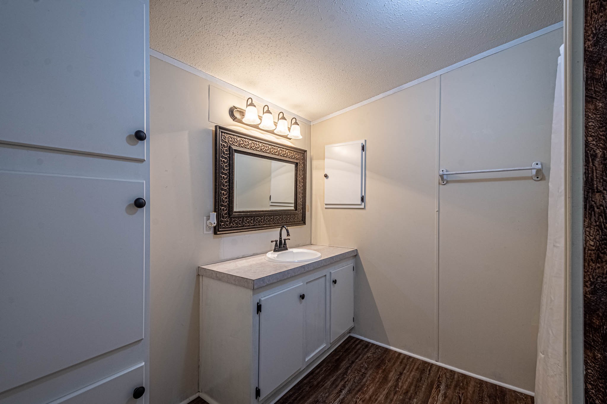 3375 Salem Road Minor Hill, TN 38473 - Photo 22 of 42 a bathroom with a toilet sink and mirror