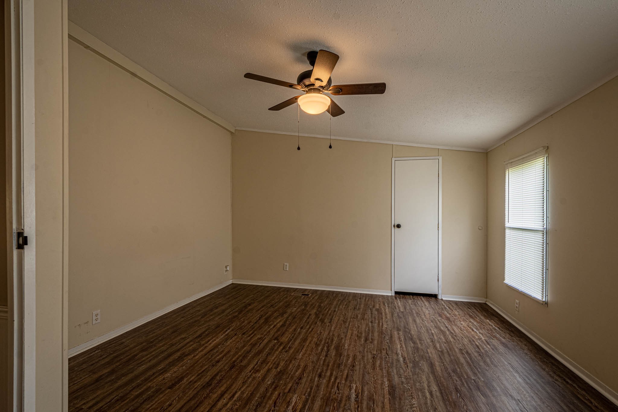 3375 Salem Road Minor Hill, TN 38473 - Photo 25 of 42 a view of empty room with wooden floor and fan