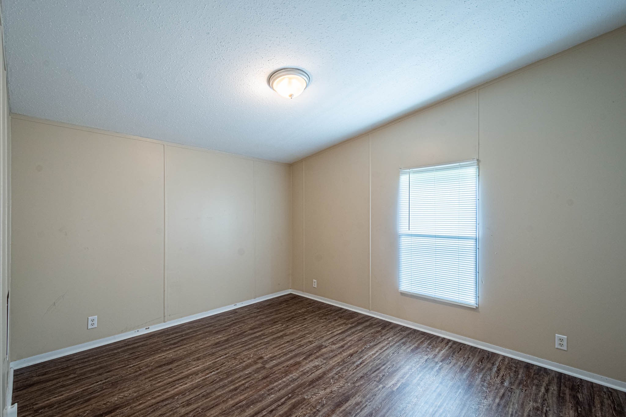 3375 Salem Road Minor Hill, TN 38473 - Photo 26 of 42 a view of an empty room with wooden floor and a window