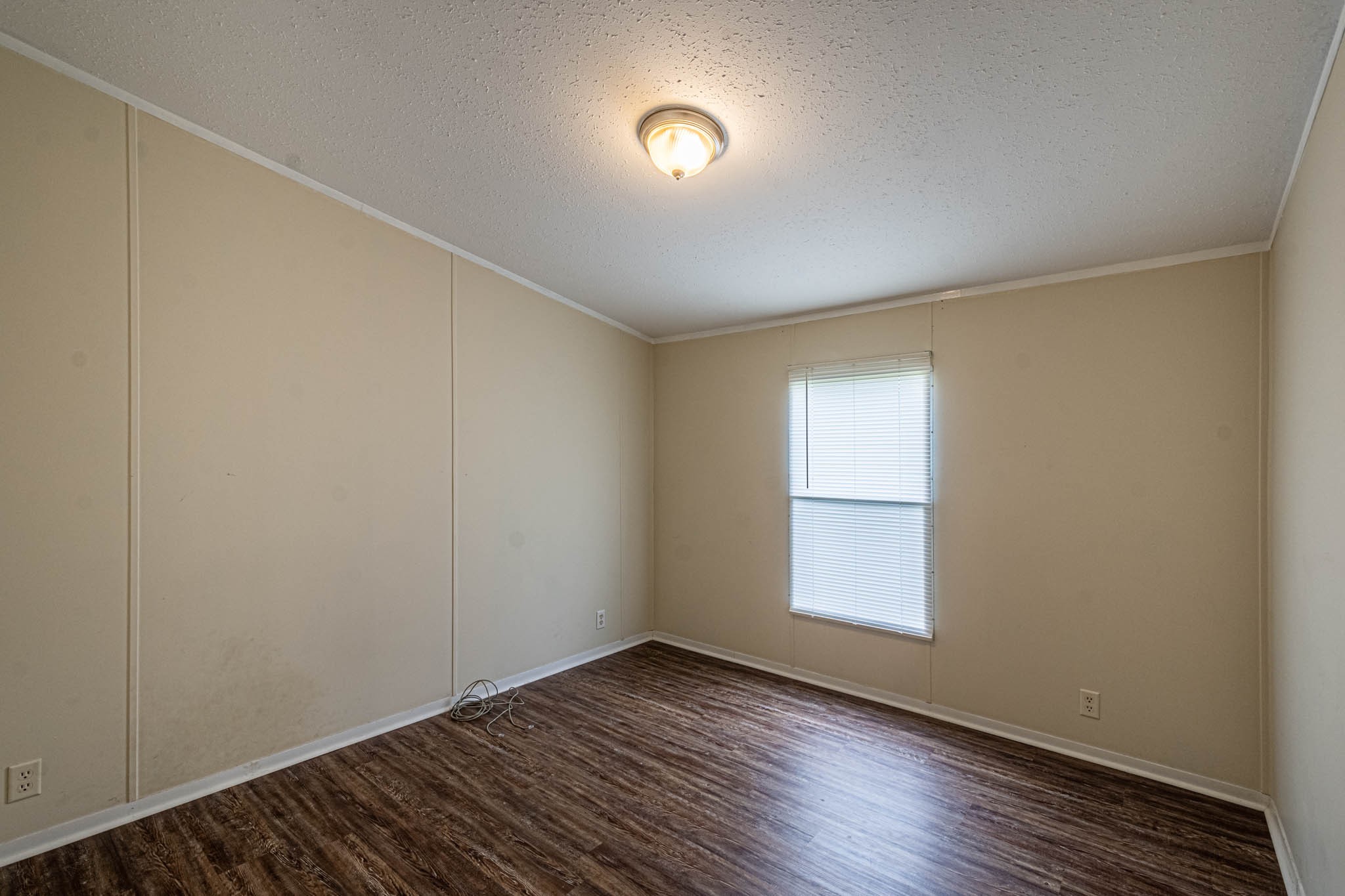 3375 Salem Road Minor Hill, TN 38473 - Photo 29 of 42 a view of an empty room with wooden floor and a window