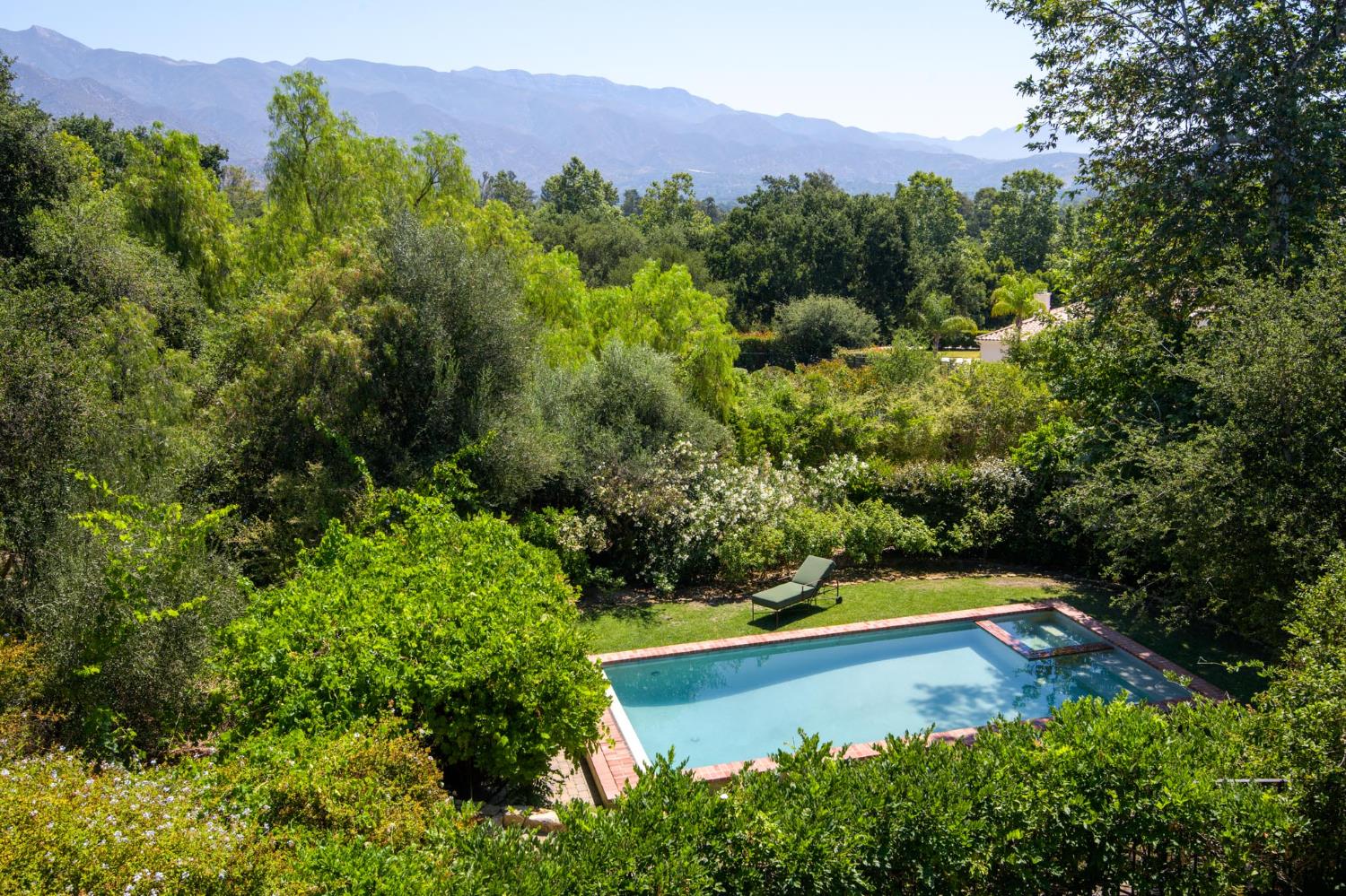 520 Foothill Road Ojai, CA 93023 - Photo 5 of 45 a view of a lush green forest with a house