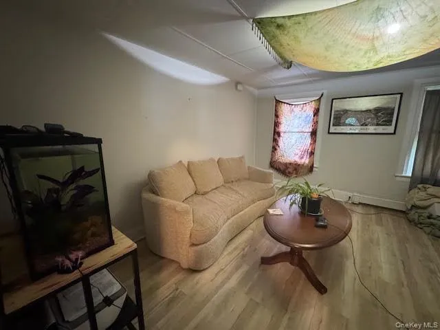 a living room with furniture and a mirror