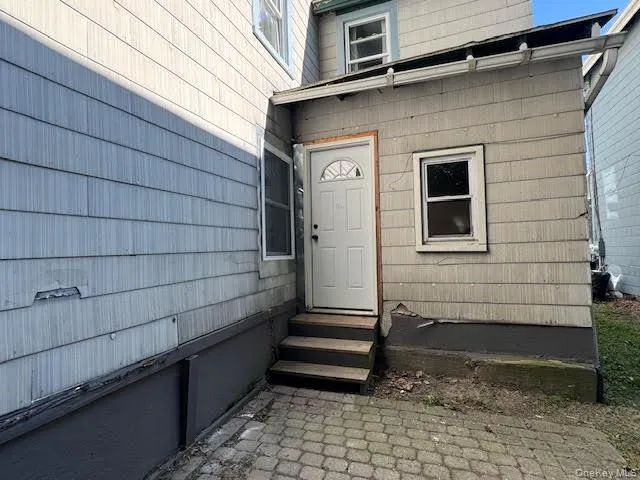 a side view of a house with a window