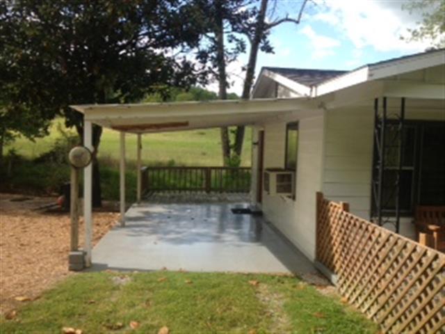 134 Carlisle Road Dover, TN 37058 - Photo 4 of 10 One car carport adjoins side entrance.