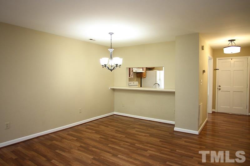 4635 Fawnbrook Circle Raleigh, NC 27612 - Photo 4 of 12 a view of empty room with wooden floor