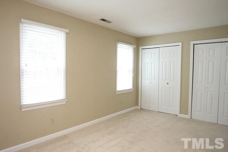 4635 Fawnbrook Circle Raleigh, NC 27612 - Photo 6 of 12 a view of an empty room with a window