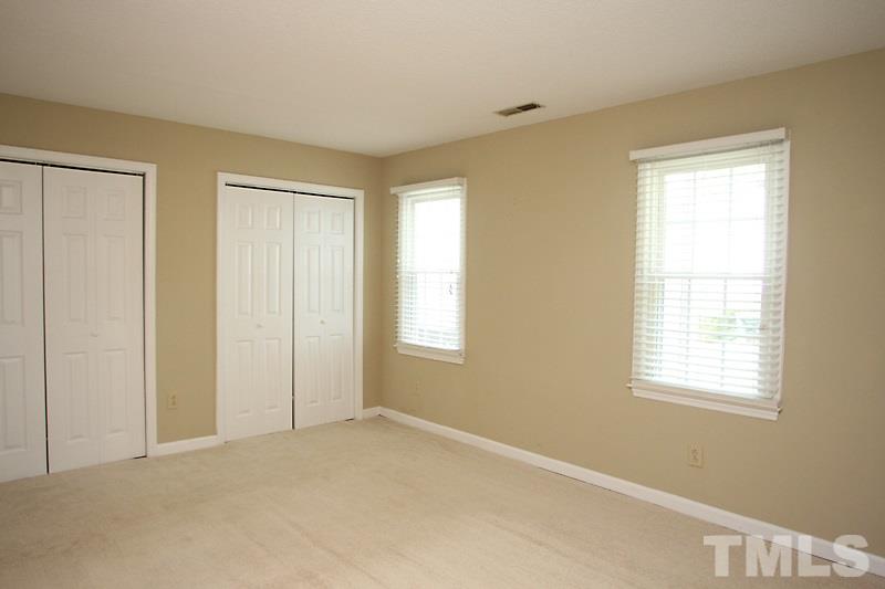 4635 Fawnbrook Circle Raleigh, NC 27612 - Photo 8 of 12 a view of an empty room with a window