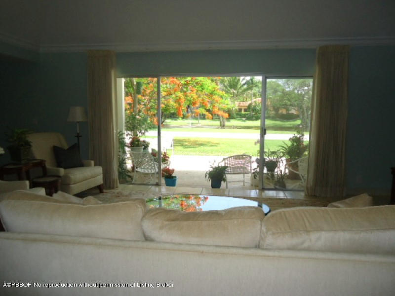5 Little Pond Road Manalapan, FL 33462 - Photo 3 of 19 a lobby with a floor to ceiling window and an outdoor space