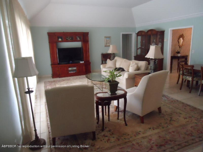 5 Little Pond Road Manalapan, FL 33462 - Photo 4 of 19 a living room with furniture and a flat screen tv