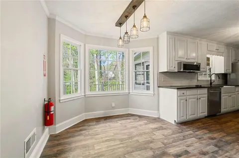a kitchen with a sink and cabinets