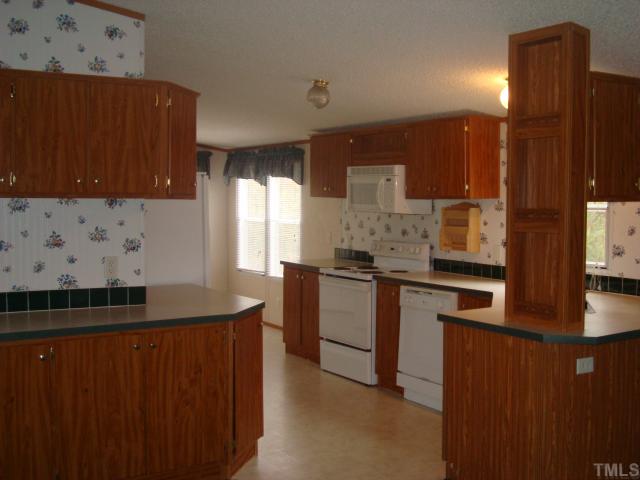 1312 Pennock Road Durham, NC 27703 - Photo 4 of 6 A Clean well kept kitchen. All appliances stay with house
