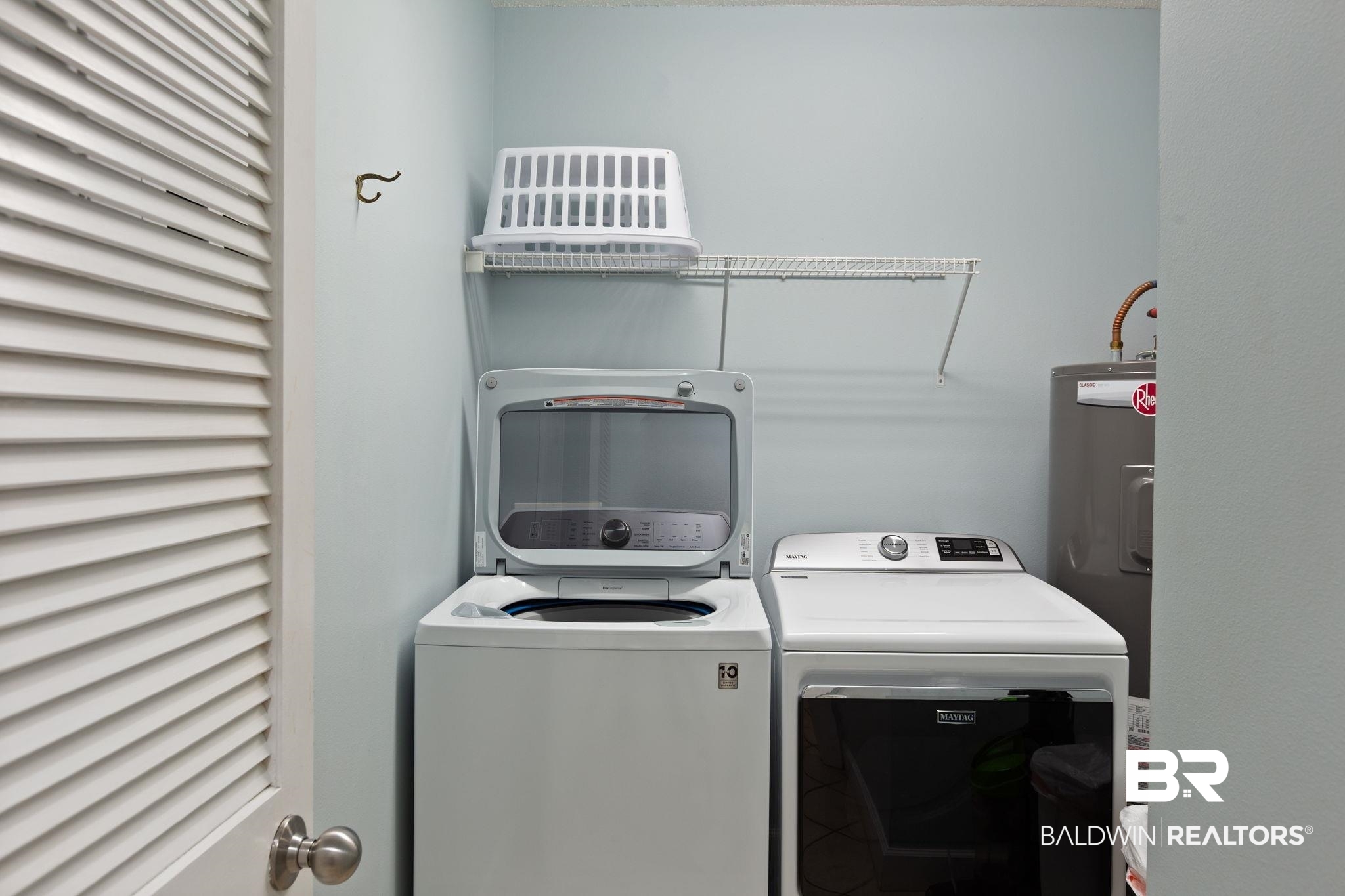 27580 Canal Road, Unit 1112 Orange Beach, AL 36561 - Photo 23 of 50 Laundry room featuring washer and clothes dryer and electric water heater
