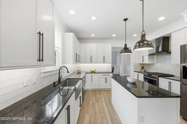 a living room with furniture a rug and a table