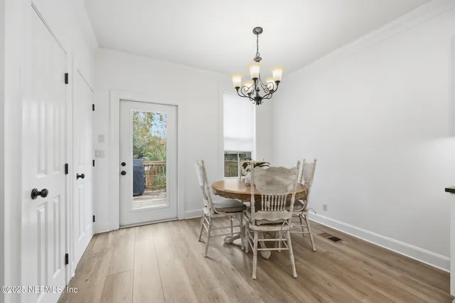 a spacious bedroom with a bed a couch and a window