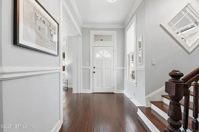 a view of a dining room with furniture and window