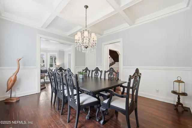 a open kitchen with stainless steel appliances granite countertop a sink a stove and a wooden floors