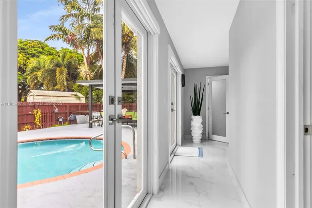 a view of backyard with deck and seating space