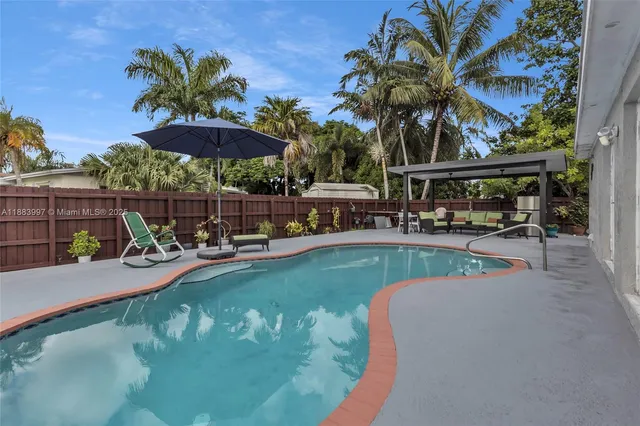 a view of a swimming pool with a patio
