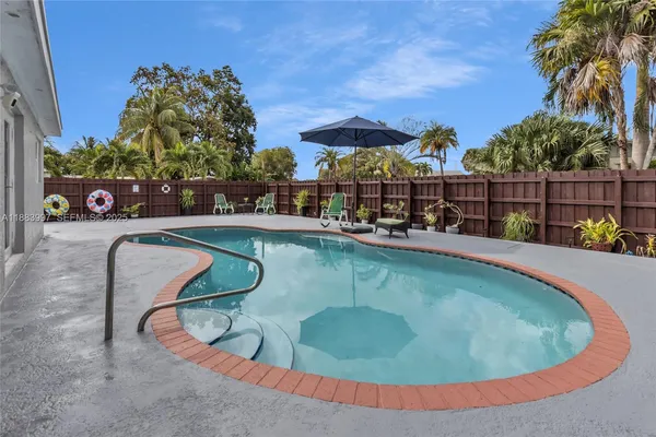 a view of an chairs and tables in the patio