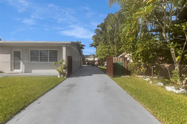 a bathroom with a sink vanity mirror and toilet