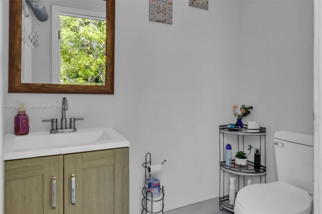 a bathroom with a sink and a window