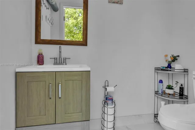 a view of a house with potted plants