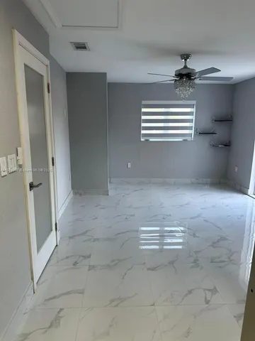 a view of a backyard of the house