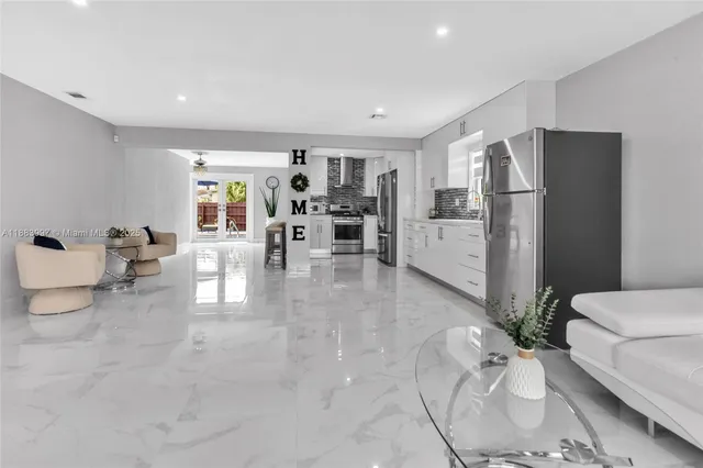 a living room with furniture and white walls