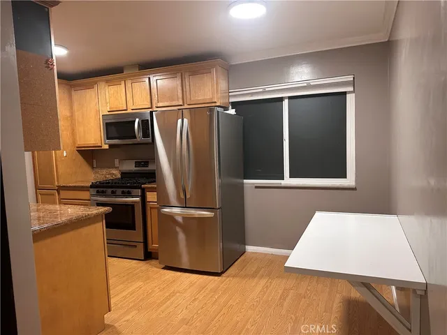 a living room with furniture and a walk in closet
