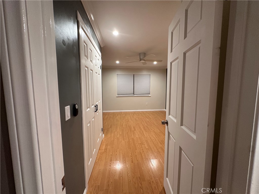6600 Warner Avenue, Unit 210 Huntington Beach, CA 92647 - Photo 14 of 47 a view of hallway with wooden floor