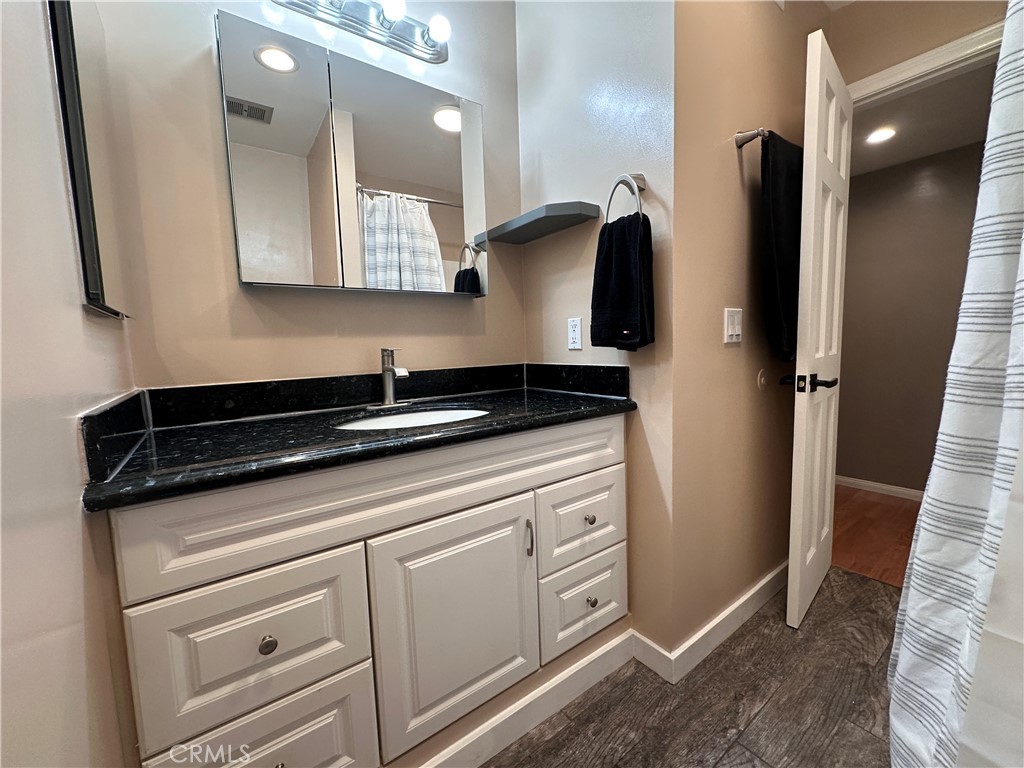 6600 Warner Avenue, Unit 210 Huntington Beach, CA 92647 - Photo 15 of 47 a view of a sink and mirror