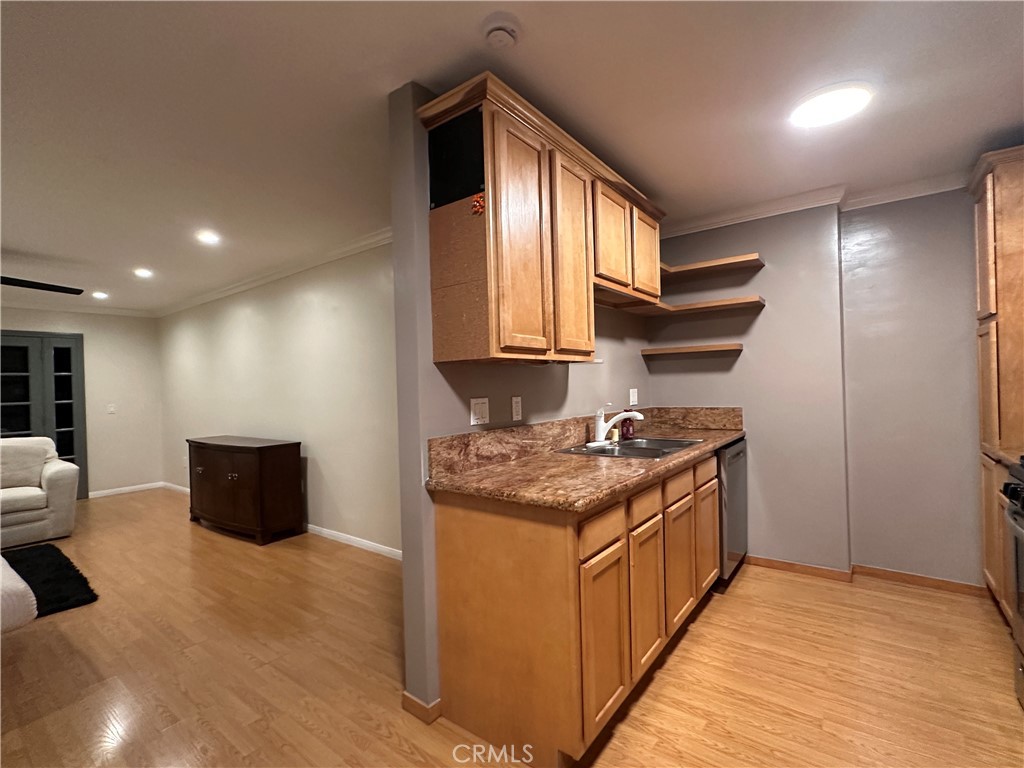 6600 Warner Avenue, Unit 210 Huntington Beach, CA 92647 - Photo 21 of 47 a kitchen with stainless steel appliances granite countertop a stove and a refrigerator