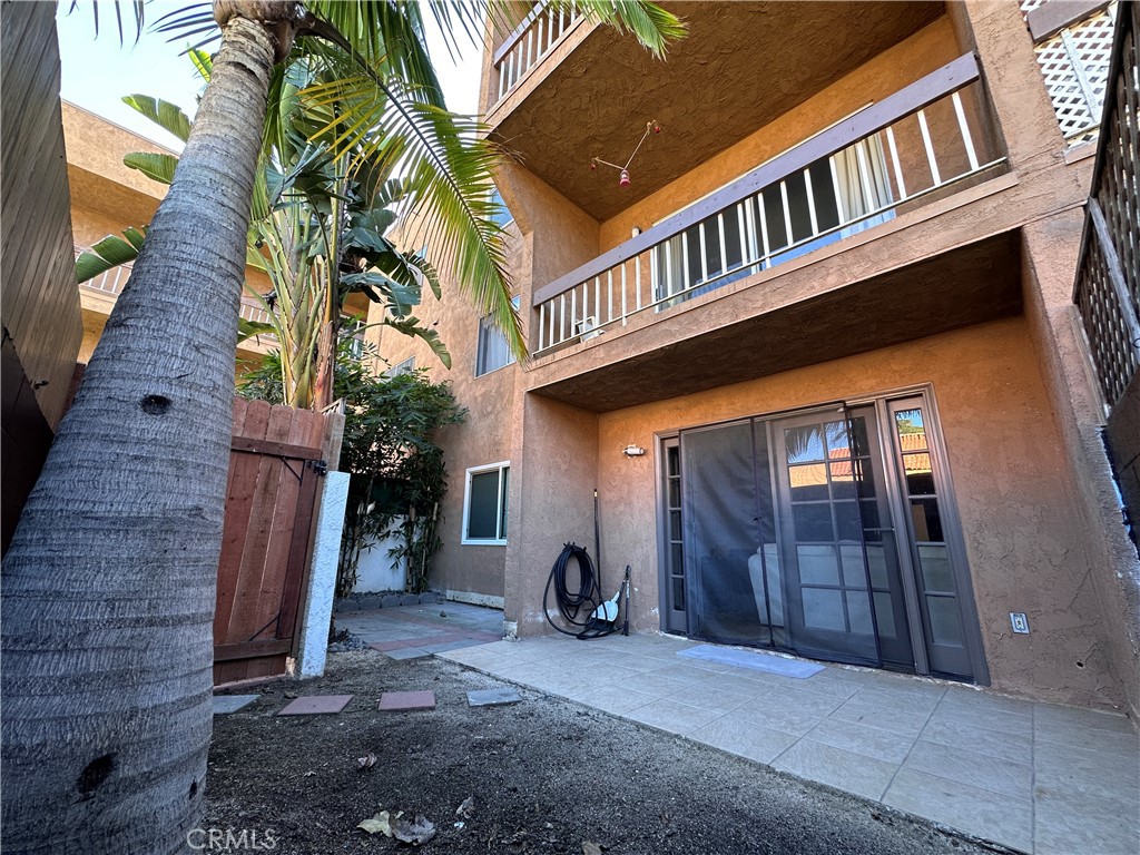 6600 Warner Avenue, Unit 210 Huntington Beach, CA 92647 - Photo 36 of 47 a front view of a house with a garage
