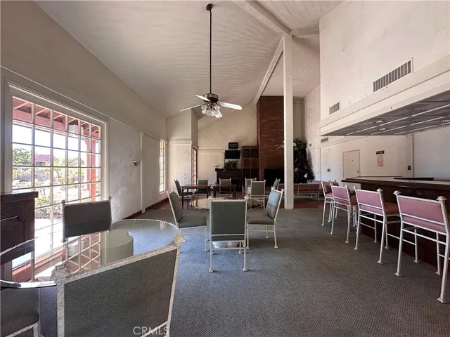 a room with pool table and window