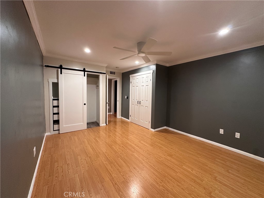 6600 Warner Avenue, Unit 210 Huntington Beach, CA 92647 - Photo 4 of 47 a view of empty room with wooden floor