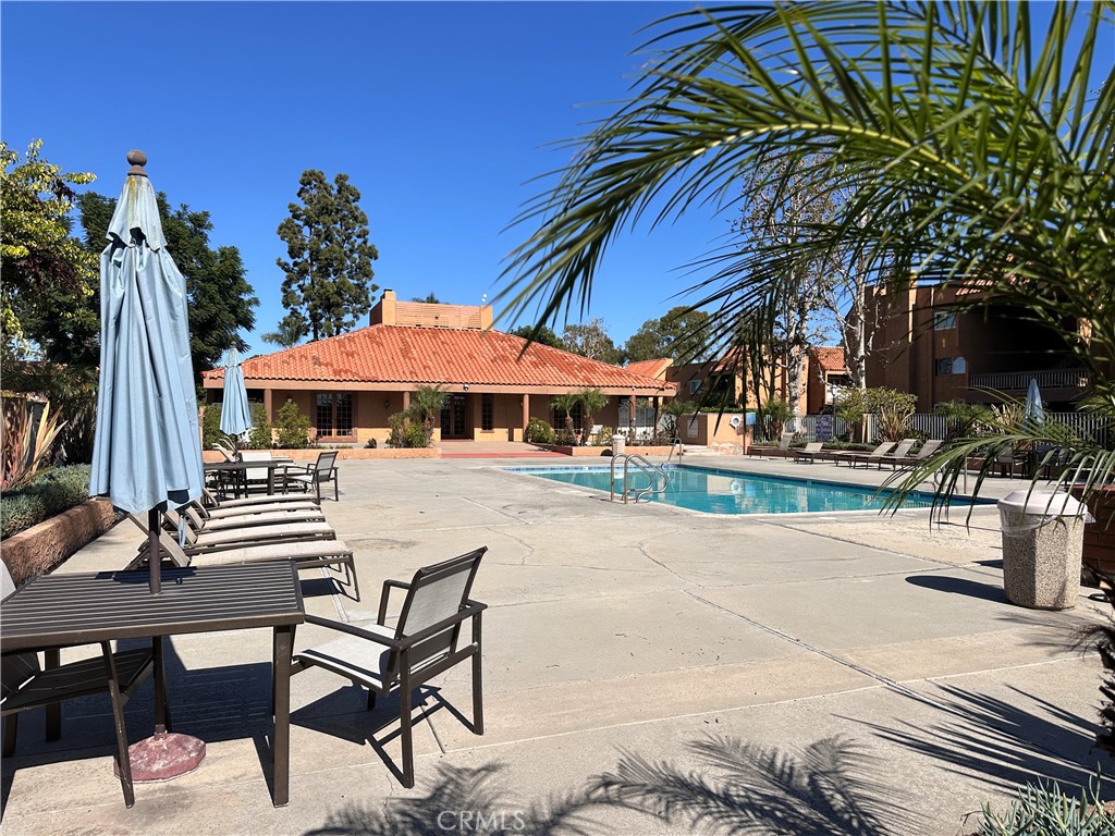 6600 Warner Avenue, Unit 210 Huntington Beach, CA 92647 - Photo 46 of 47 a view of house with outdoor space and sitting area