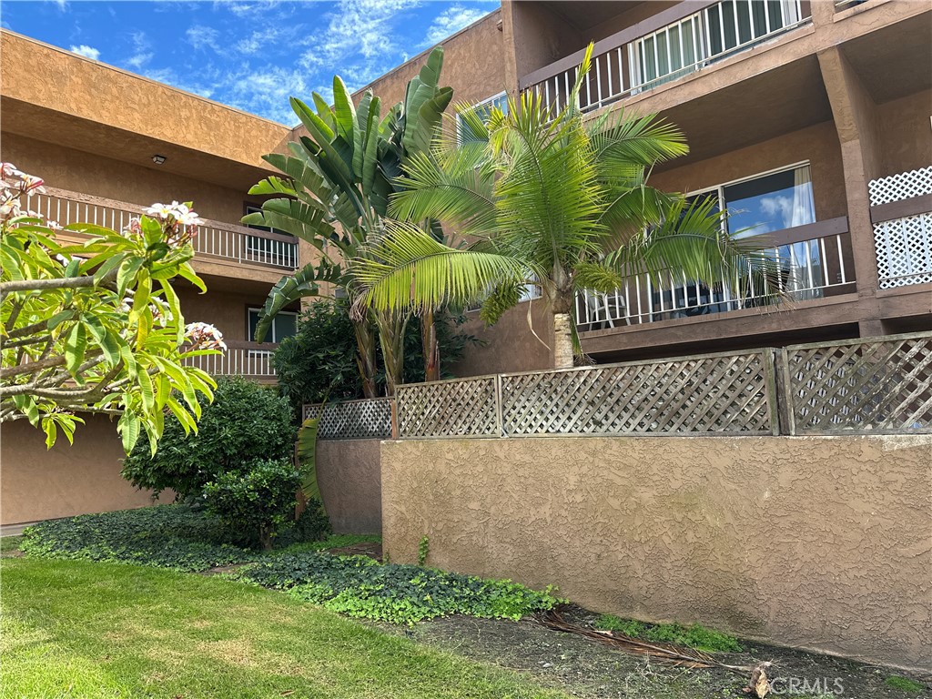 6600 Warner Avenue, Unit 210 Huntington Beach, CA 92647 - Photo 5 of 47 a view of a house with a yard