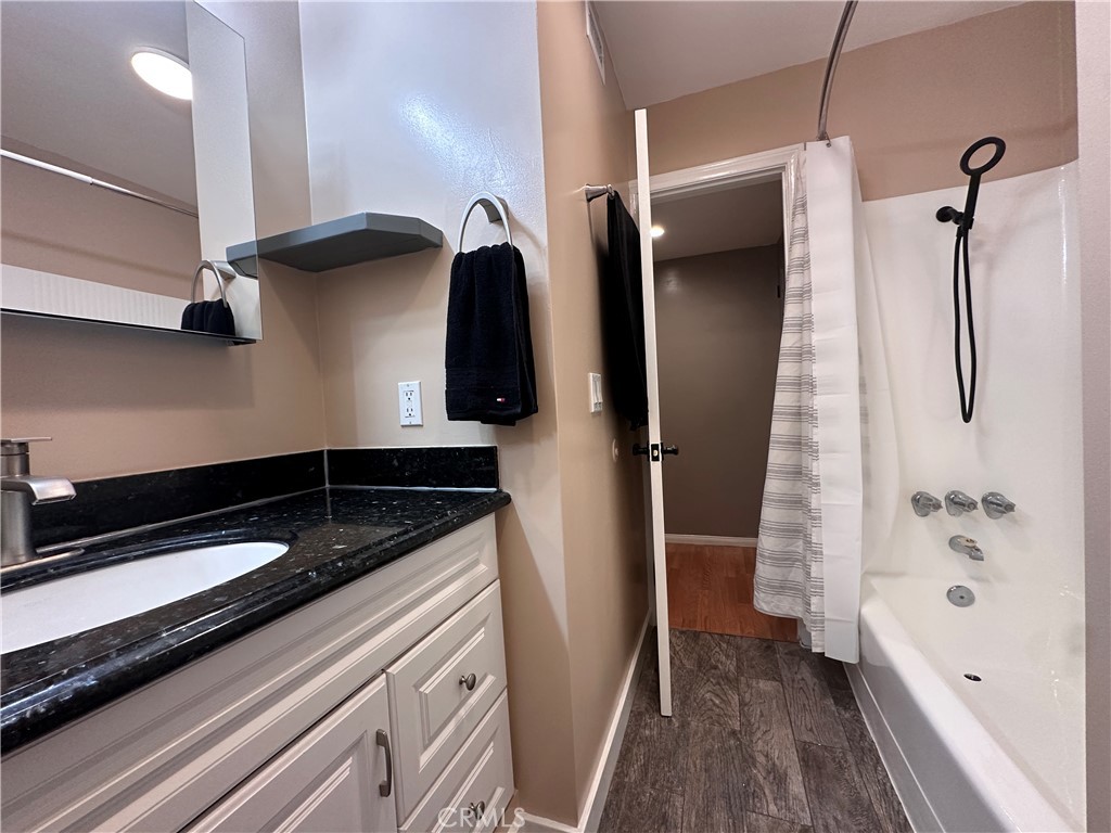 6600 Warner Avenue, Unit 210 Huntington Beach, CA 92647 - Photo 10 of 47 a kitchen with a refrigerator and a sink