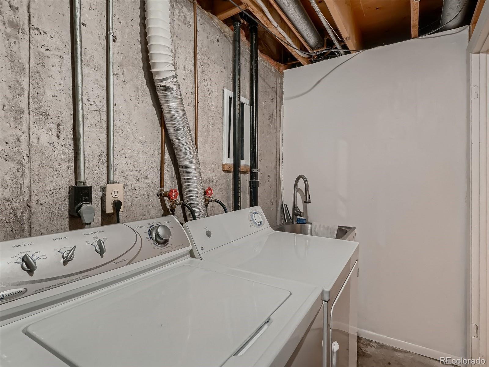 1230 South Reed Street, Unit 4 Lakewood, CO 80232 - Photo 24 of 28 a bathroom with a tub and a sink