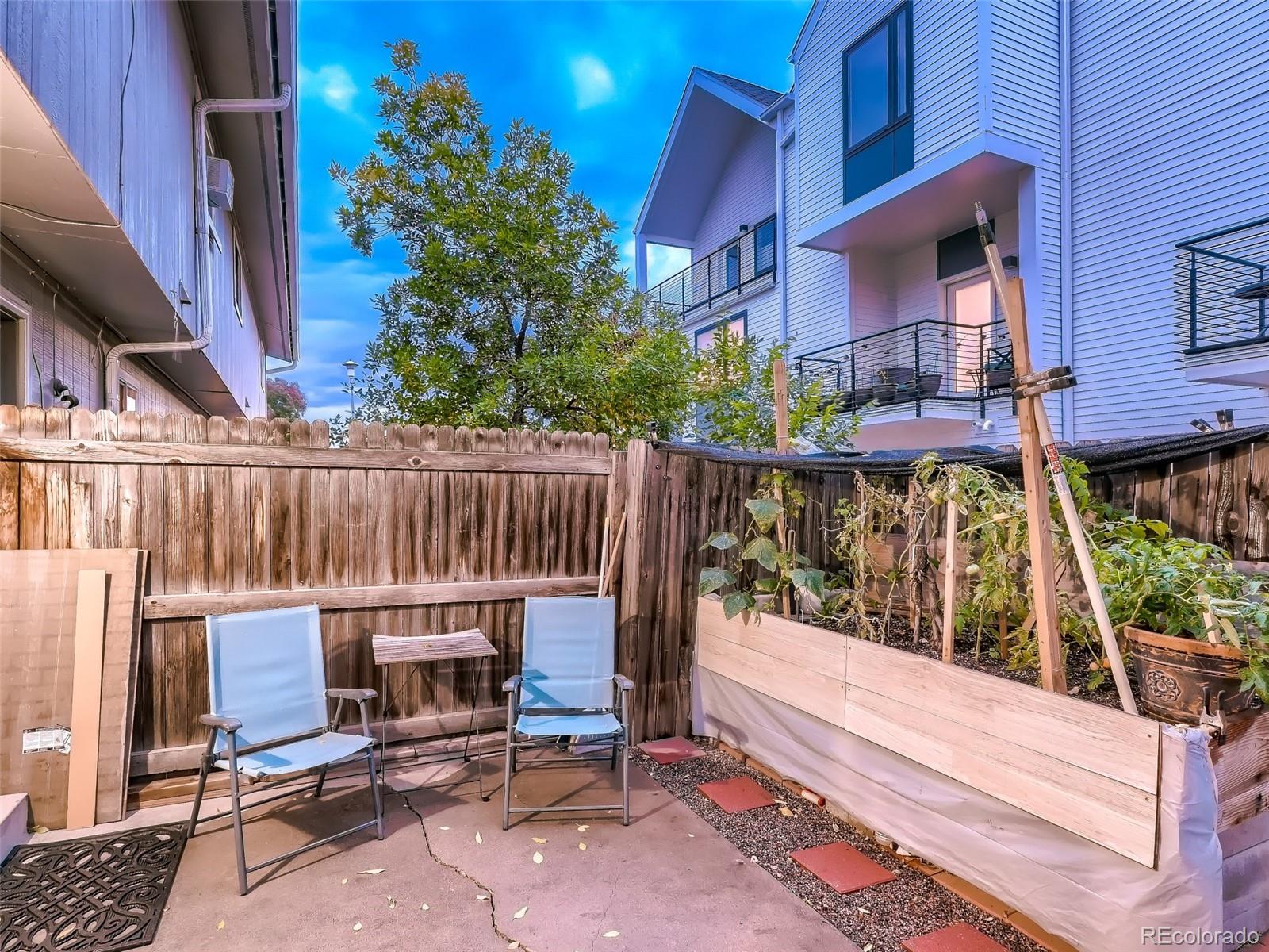 1230 South Reed Street, Unit 4 Lakewood, CO 80232 - Photo 26 of 28 a view of a chair and tables in the balcony