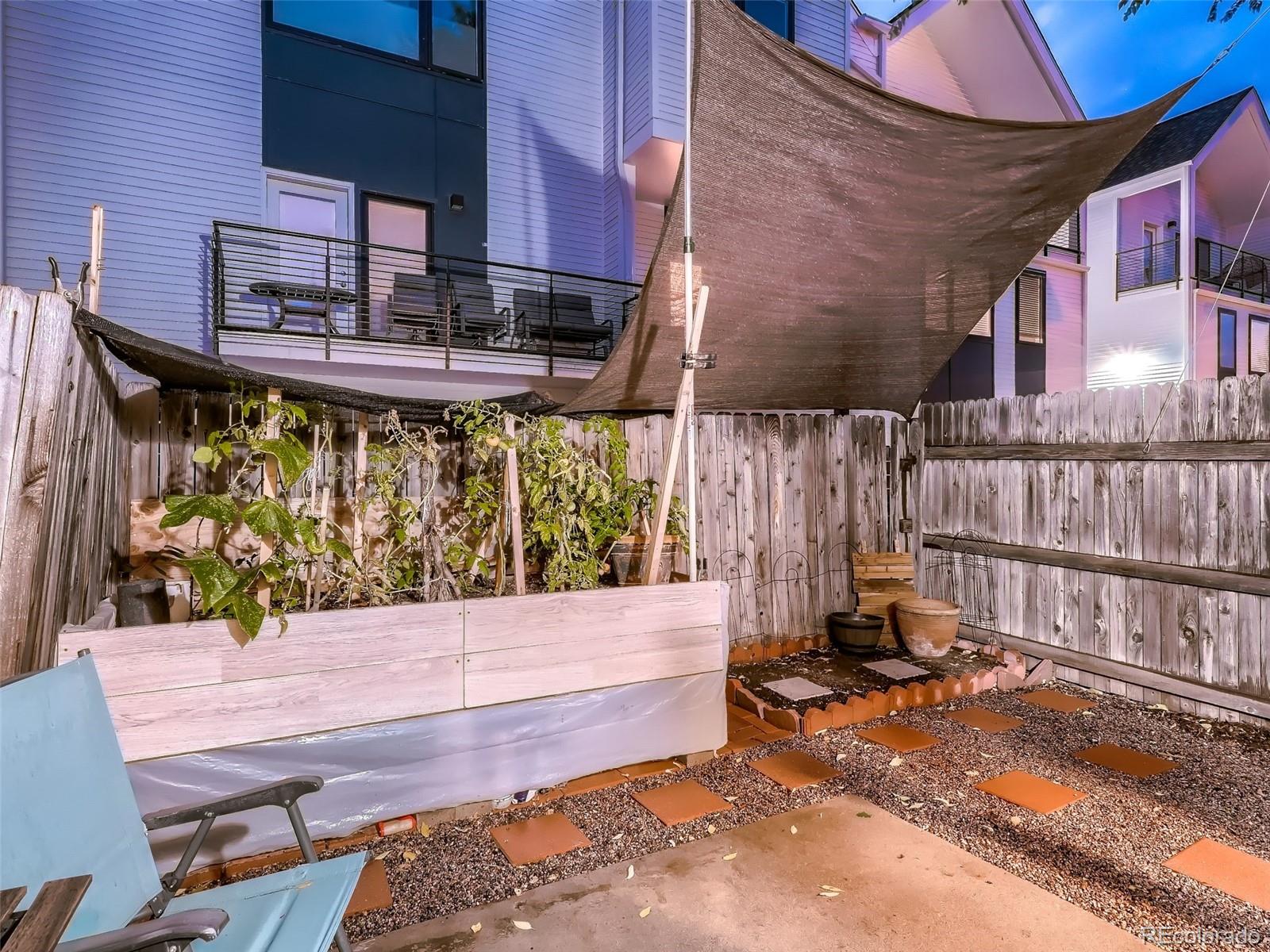 1230 South Reed Street, Unit 4 Lakewood, CO 80232 - Photo 27 of 28 a view of a patio with a table and chairs