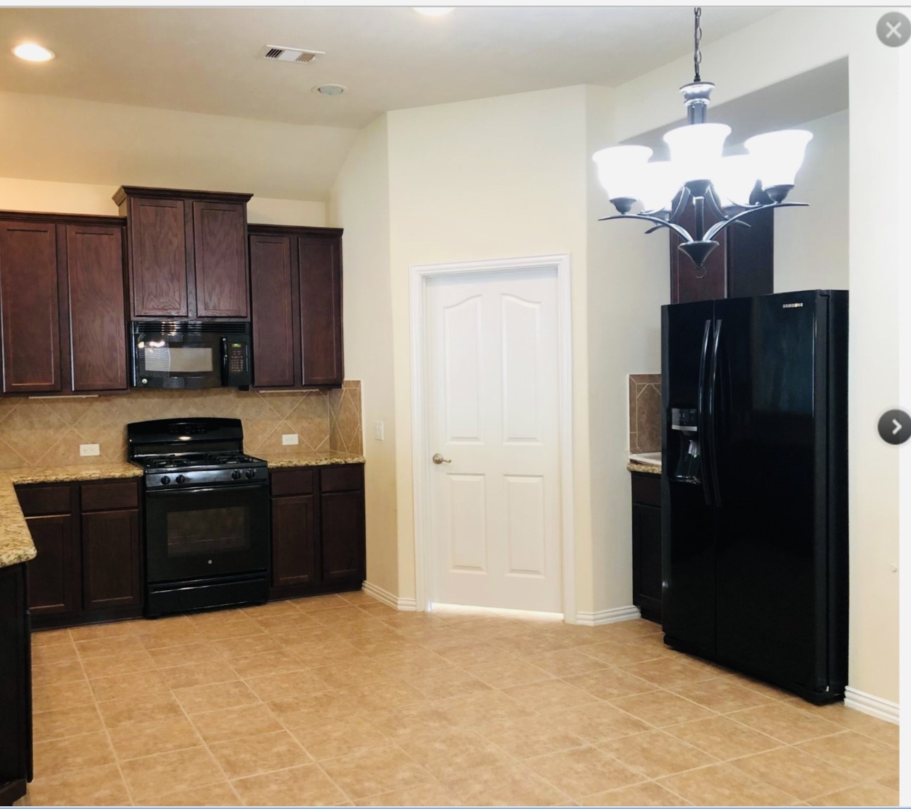 25622 Forest Springs Lake Spring, TX 77373 - Photo 2 of 8 a kitchen with stainless steel appliances granite countertop a refrigerator a stove top oven