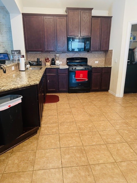 25622 Forest Springs Lake Spring, TX 77373 - Photo 3 of 8 a kitchen with stainless steel appliances granite countertop a stove a sink and a cabinets