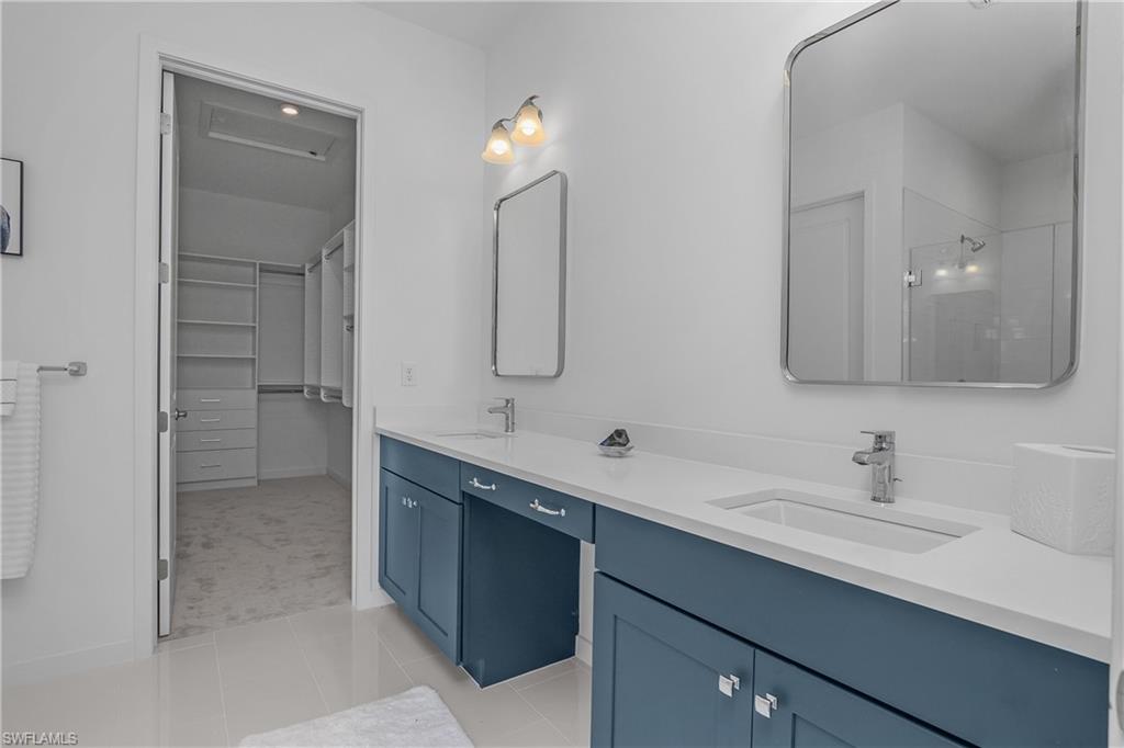 14854 Loggerhead Drive Naples, FL 34120 - Photo 18 of 36 Master bathroom with double vanity and walk in closet