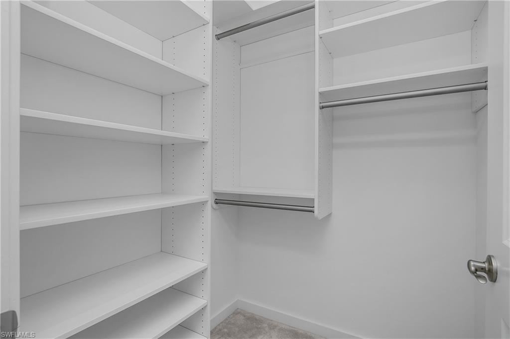 14854 Loggerhead Drive Naples, FL 34120 - Photo 24 of 36 Second bedroom Walk in closet with light