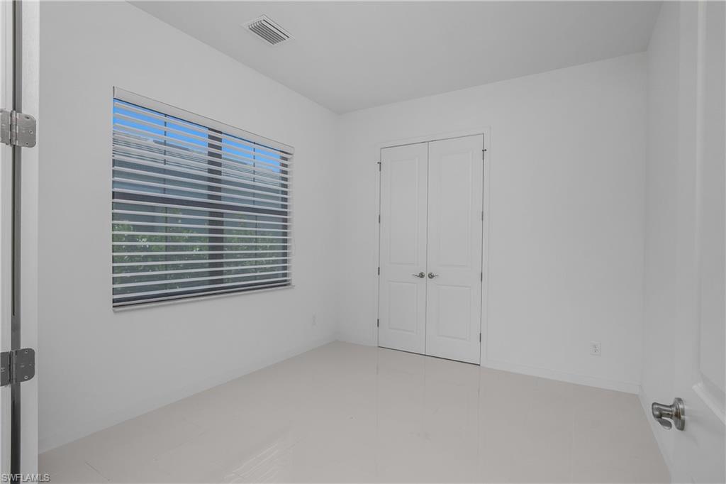14854 Loggerhead Drive Naples, FL 34120 - Photo 27 of 36 Third bedroom with a closet