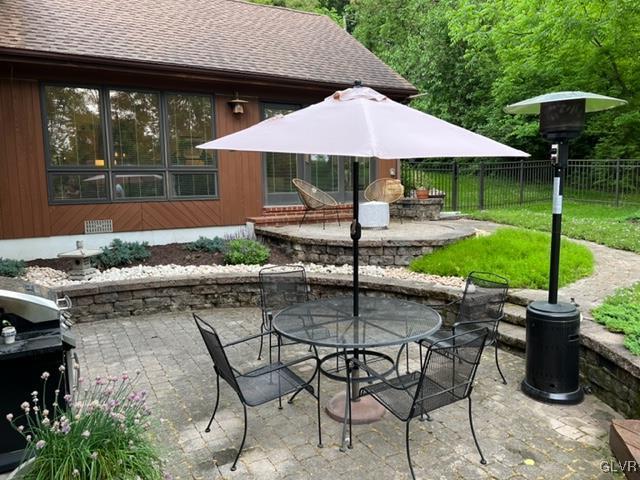 19 Bridle Path Road Bethlehem, PA 18017 - Photo 30 of 34 a backyard of a house with table and chairs under an umbrella