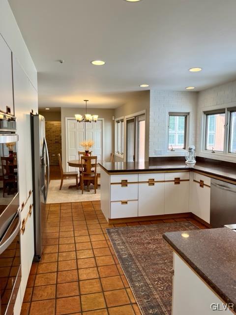 19 Bridle Path Road Bethlehem, PA 18017 - Photo 10 of 34 a large white kitchen with a large window and stainless steel appliances