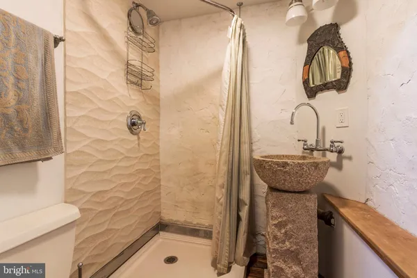 a bathroom with a sink and a shower