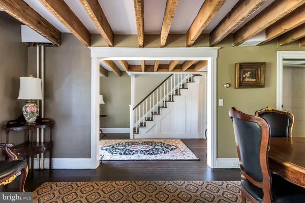 a view of an entryway with wooden floor